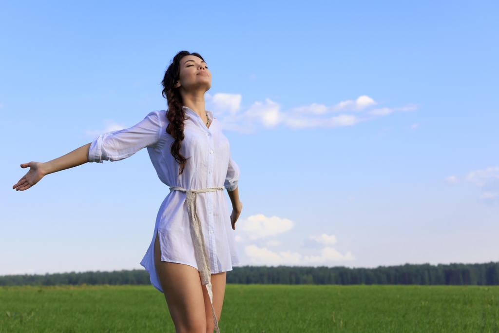 stock-photo-young-happy-woman-in-green